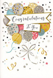 The photograph captures a joyful congratulations card whose design feels quietly radiant, the kind of piece you might select while planning a celebration in Brockley or nearby Ladywell. At the centre of the card floats a generous cluster of balloons, softly rounded and overlapping in a balanced arrangement. Their colours are harmonious and refined: muted gold, shining silver, champagne cream, airy sky blue and tender blush pink. Each balloon carries delicate decoration-glitter-sprinkled stars, slim metallic stripes, or fine dotted patterns-that lends a sense of light catching on their surfaces, as though they were drifting beneath soft party lights. From the base of the cluster, fine ribbons in gold and silver fall and curl gracefully, providing visual rhythm and gently guiding the eye downward. Scattered around the balloons, tiny stars, swirling ribbons and sprinklings of confetti glide across a light, almost velvety background, suggesting movement and the joyful energy of a surprise announcement shared over coffee on Brockley Road. Cutting through the centre is an elegant banner bearing the words Congratulations To You in smooth, looping calligraphy that communicates warmth, pride and affection with just a glance. The card's finish hints at a mix of glossy print and lightly raised glitter details, inviting touch much like the varied surfaces of leaves and petals in a fresh floral arrangement. The mood is celebratory yet composed, making this design perfectly suited to honouring exam results, new jobs, promotions or creative achievements. It's easy to imagine this card nestled next to a vase of flowers, bringing a soft but unmistakable message of joy to any special moment in the Brockley community.